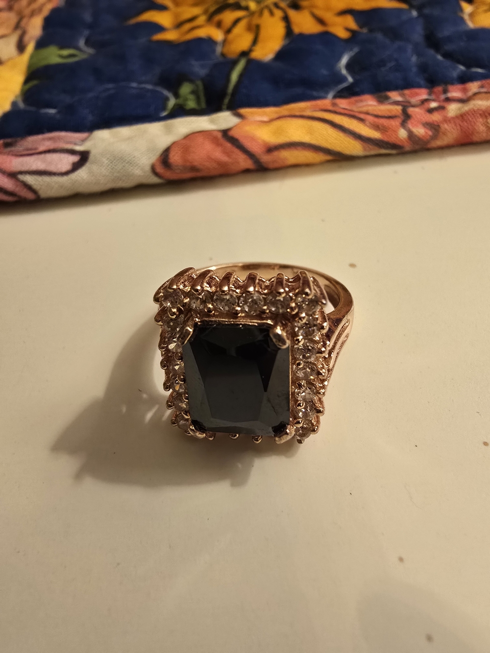 Rose Gold Ring with Deep Emerald-Cut Black Stone and Halo Accent